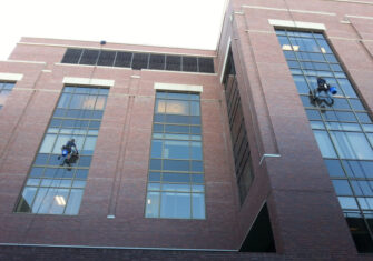 Cleaning the windows outside of a hospital. Medical Cleaning & Janitorial Services - Hospitals, Clinics