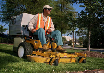 Commercial landscaper cutting grass The Right Questions to Ask When Choosing a Commercial Landscaper