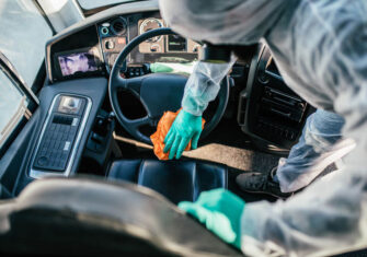 The Budd Group employee disinfecting a car Coronavirus Disinfection: Best Practices for Cleaning and Disinfecting School Buses