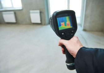 Contractor conducting infrared inspection Infrared Inspection for Roofs, Building Envelopes, and Electrical Panels