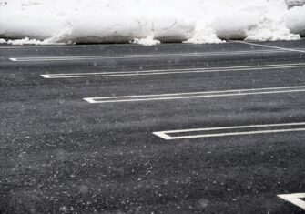 Snow removed from a parking lot. Here Is Why It's Essential to Clear Your Parking Lot After a Big Winter Storm