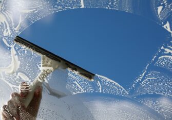 Squeegee wiping off clean window A Guide to Sparkling Clean Windows