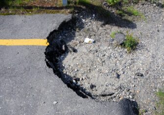 Large pothole in a parking lot Top 3 Steps to Take to Make Sure Your Parking Lot Is Safe and Maintained at Your Facility