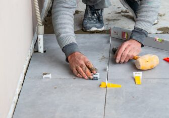 Contractor doing floor repairs Top Tips for Floor Repair Projects This Summer