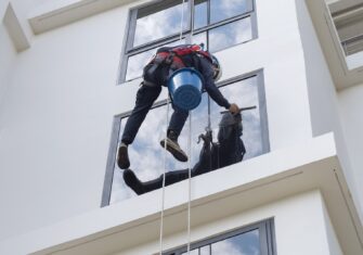 Window cleaner during construction cleanup Keeping Windows Clean After Construction and Repairs