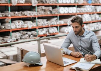 Man working at a desk in a facility Customer Care in Facility Management - How Is Your Vendor Representing You?