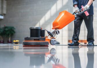 Employee cleaning a floor What You Should Know About Chemical Free Floor Stripping