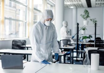 Employee disinfecting a table What Can Your Cleaning Company Do to Make Employees Feel More Comfortable Returning to the Office?