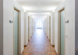 Hallways of an educational facility dorm Top 5 Steps to Take to Expedite Cleaning and Revamping Dorms at Your Education Facility