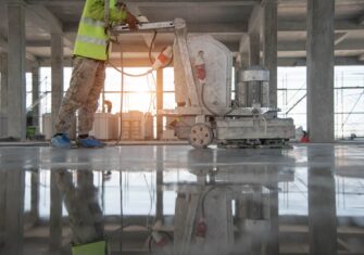 Employee polishing a concrete floor Why Summer Is a Great Time for Interior Concrete Finishing and Polishing