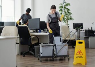 Janitorial team cleaning an office. Enhancing Workplace Safety: The Role of Janitorial Services