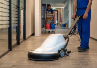 Worker cleaning a building's floor. New Year, New Maintenance Plan: Securing Enough Facility Support for Your Building's Needs