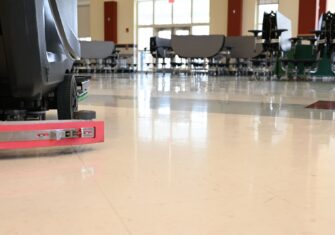 Newly polished floor in a school cafeteria. Top 7 Maintenance Services to Prioritize at Your Educational Facility This Summer Break