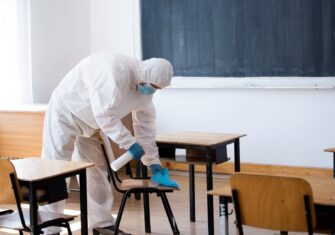 Cleaner cleaning a classroom. Top Areas in Your School That May Need Cleaning and Disinfection